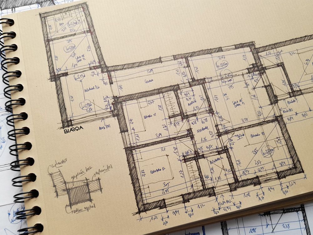 Fotografía de cuaderno con toma de datos de viviendas